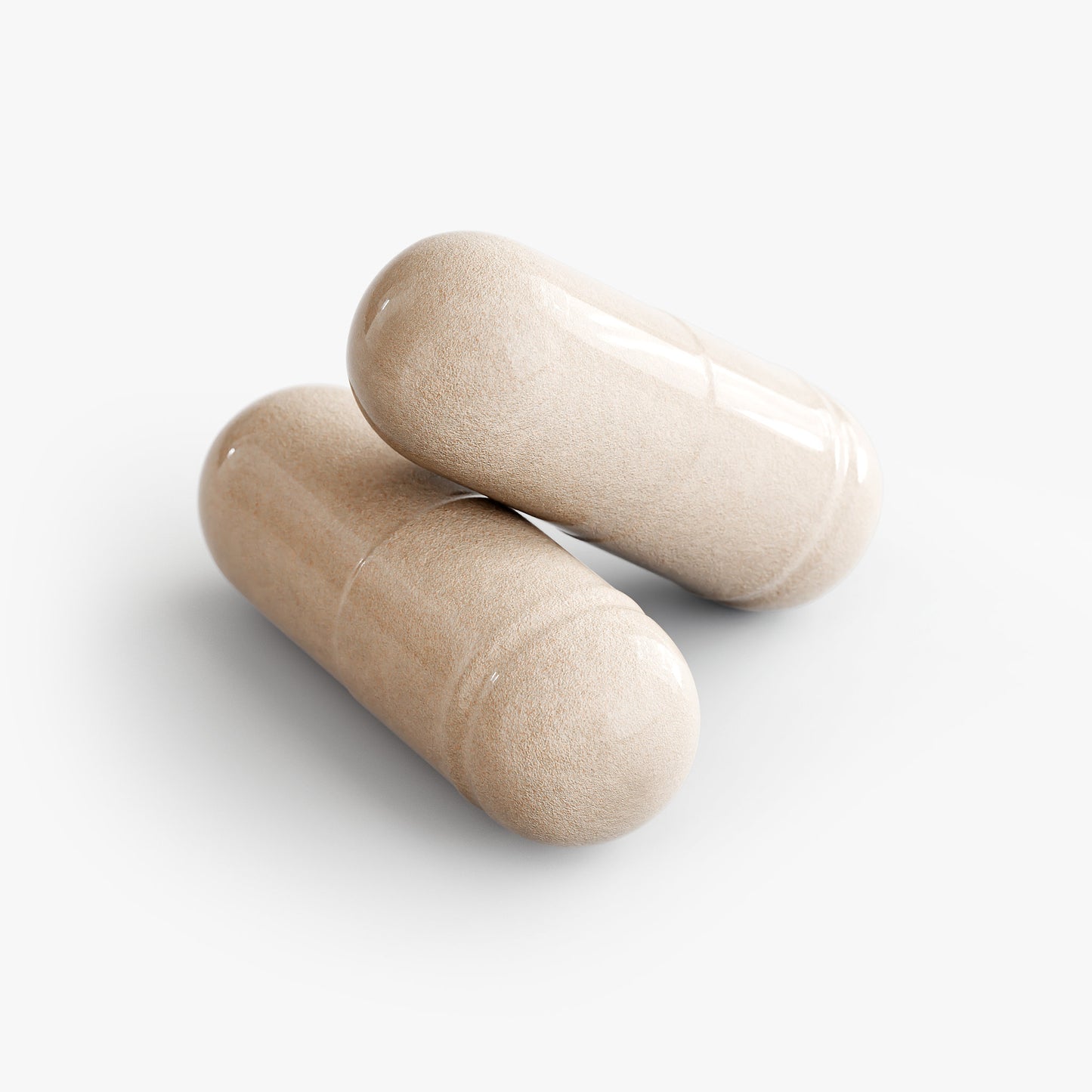 Two beige Sea Moss capsules from The Unruffled State are stacked on a plain white background.